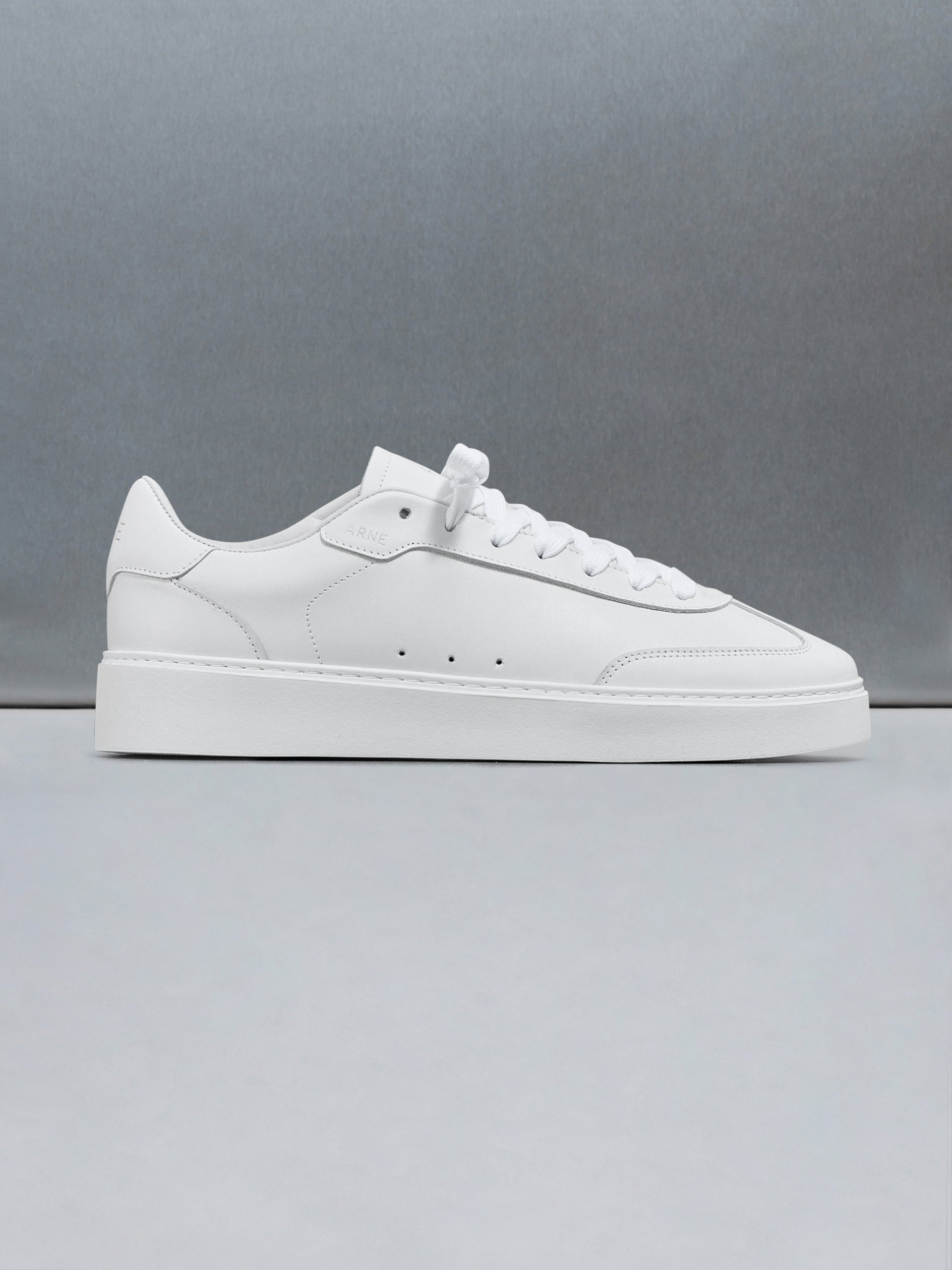Tennis Trainer in Triple White
