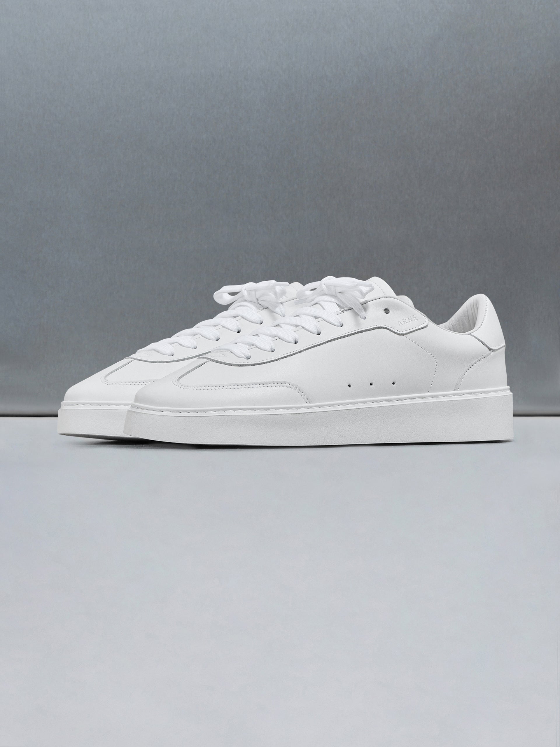 Tennis Trainer in Triple White