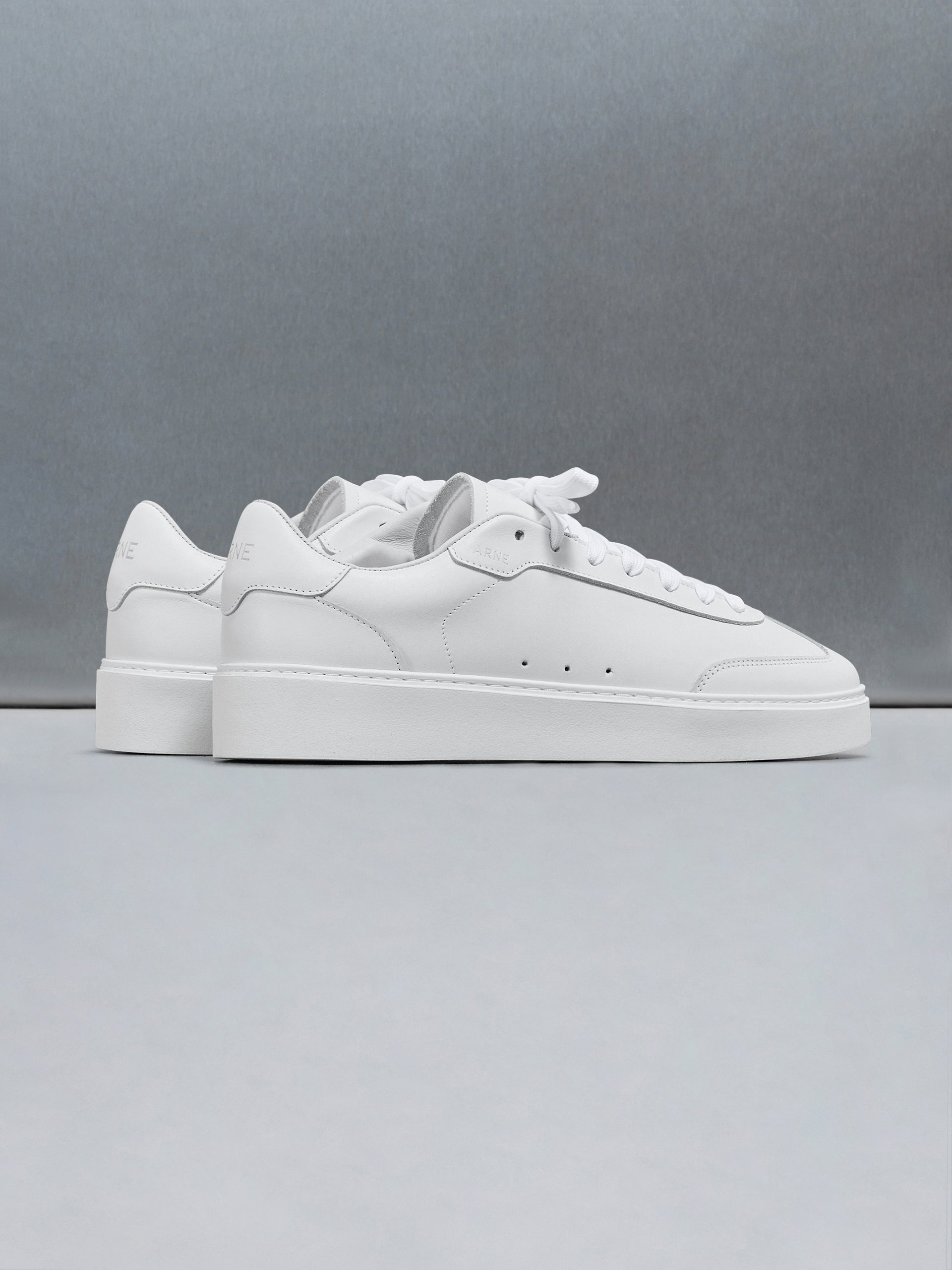 Tennis Trainer in Triple White