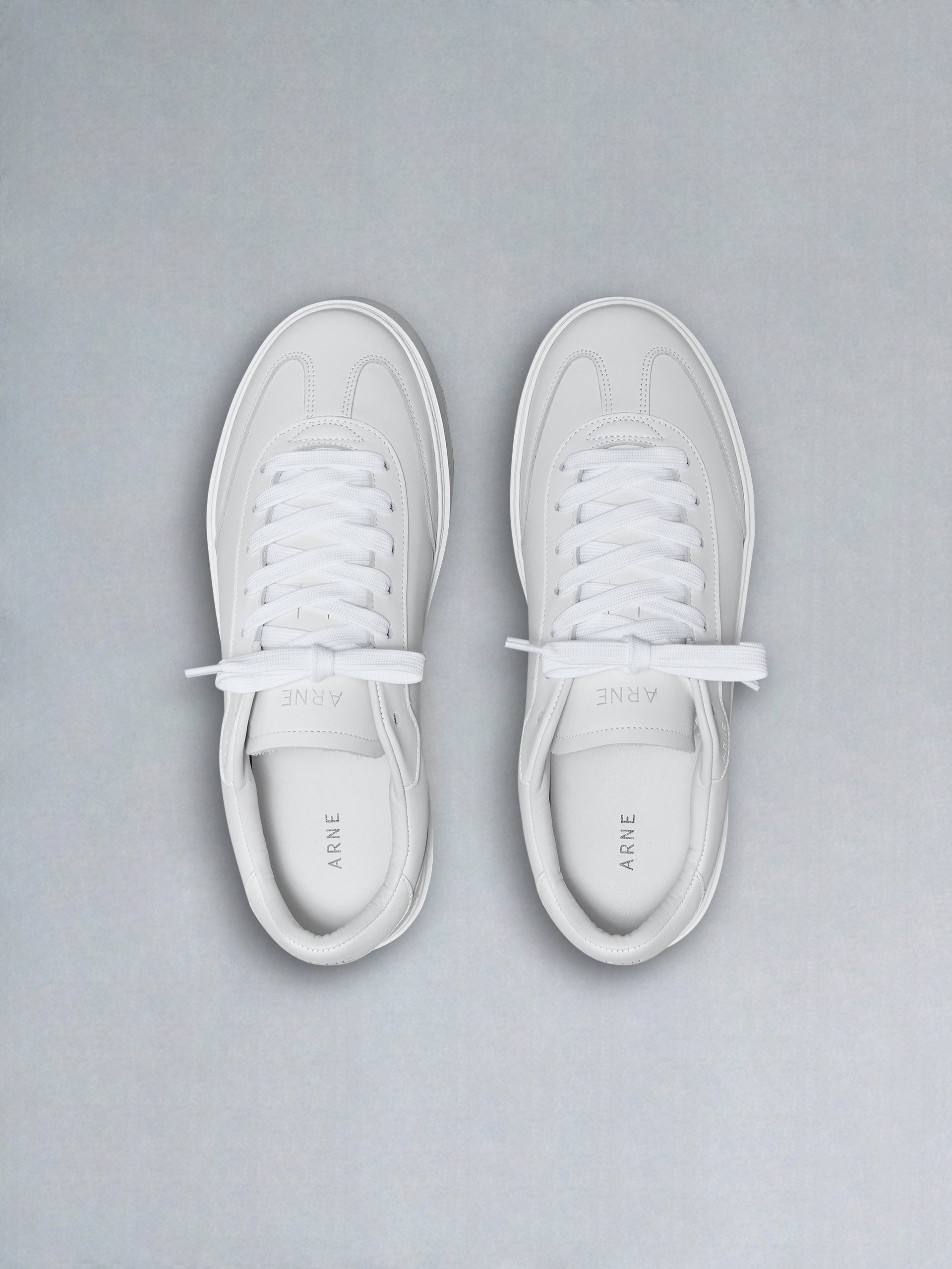 Tennis Trainer in Triple White